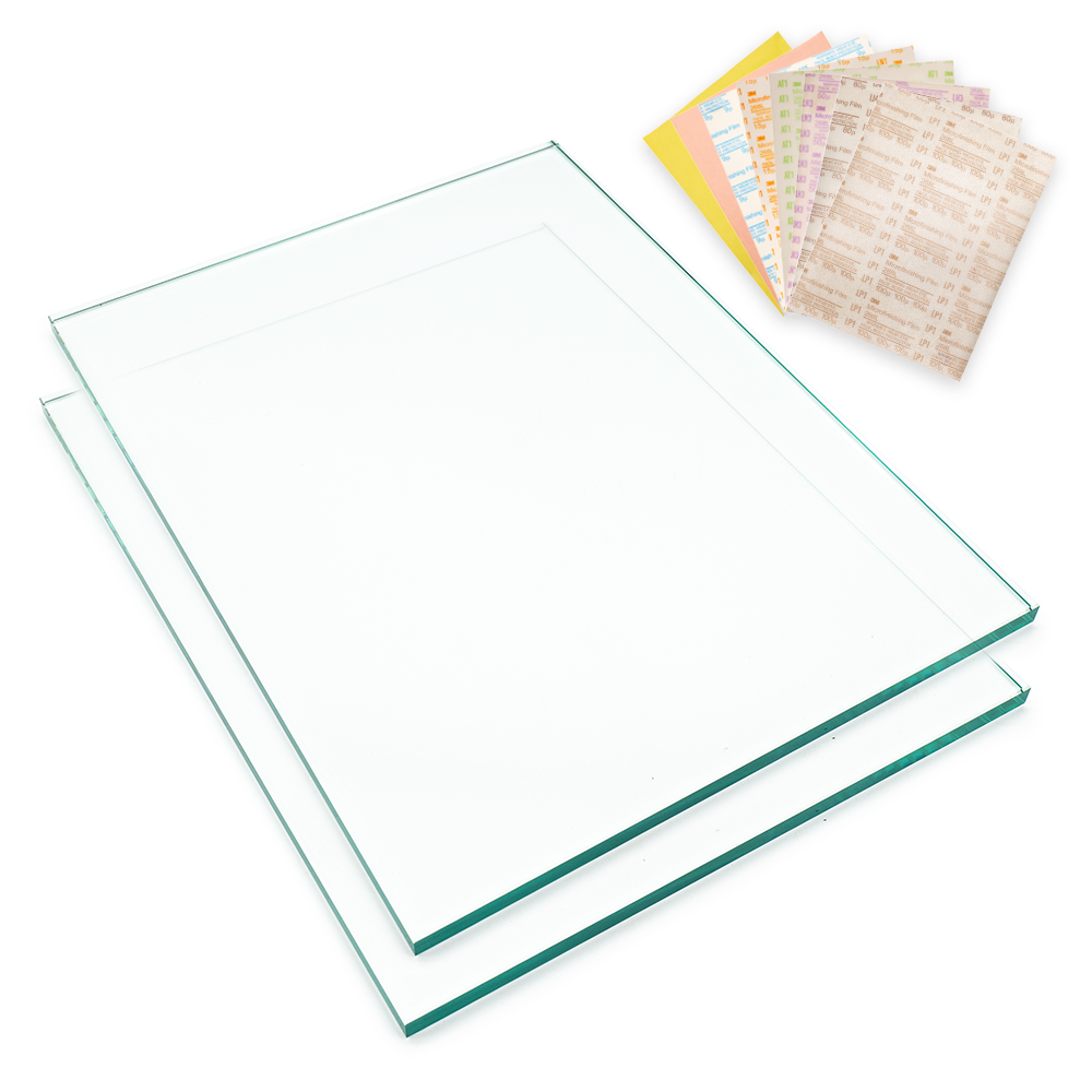 Two large Dead Flat Glass sharpening plates with the Complete eight-grade sharpening film pack